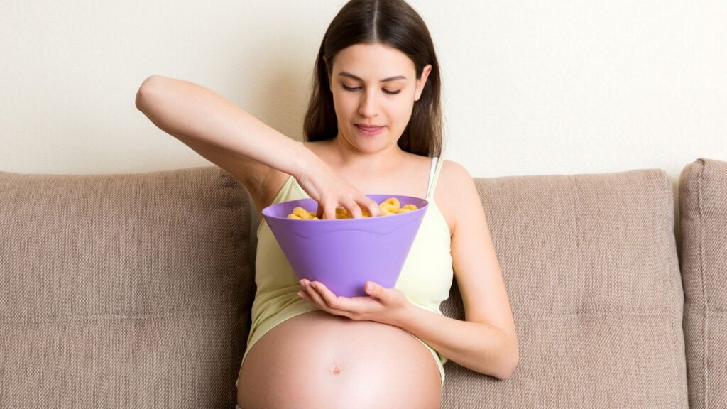 pregnant lady eating junk food